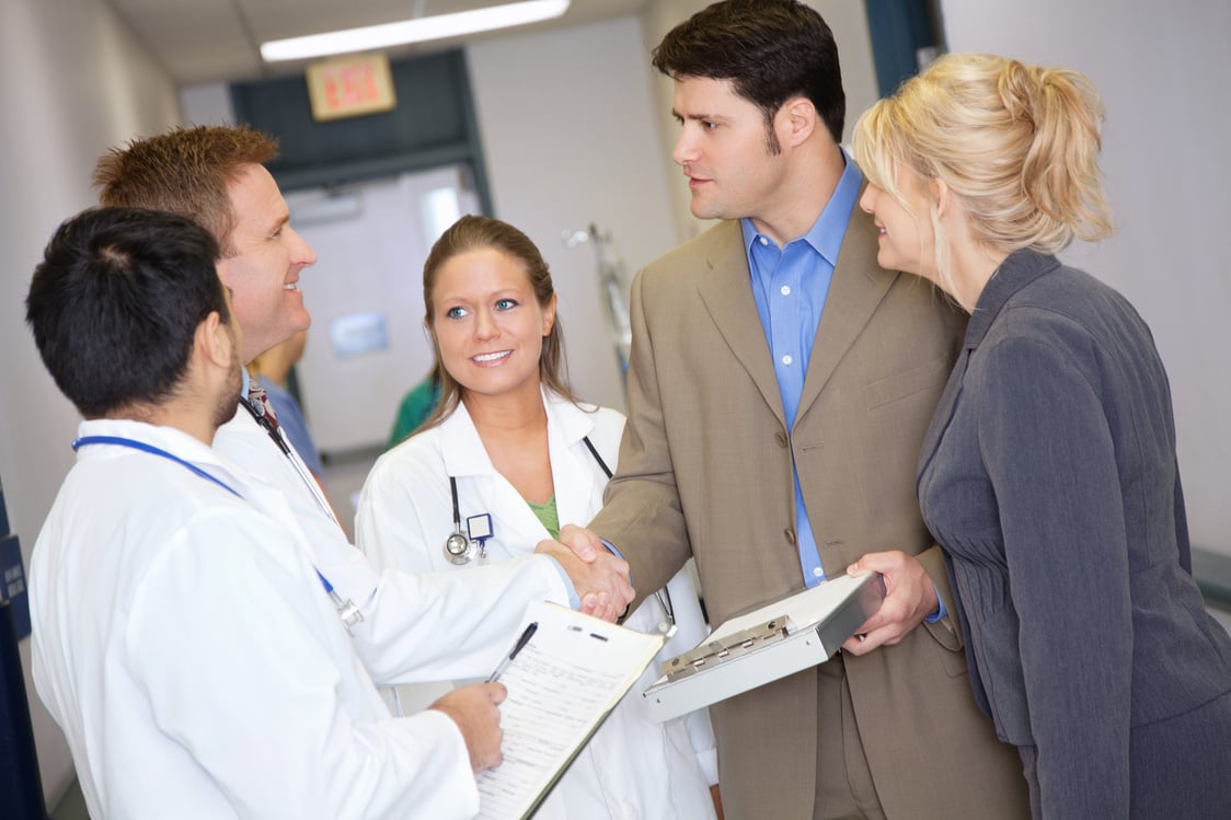 Hospital administrators being greeted by medical staff